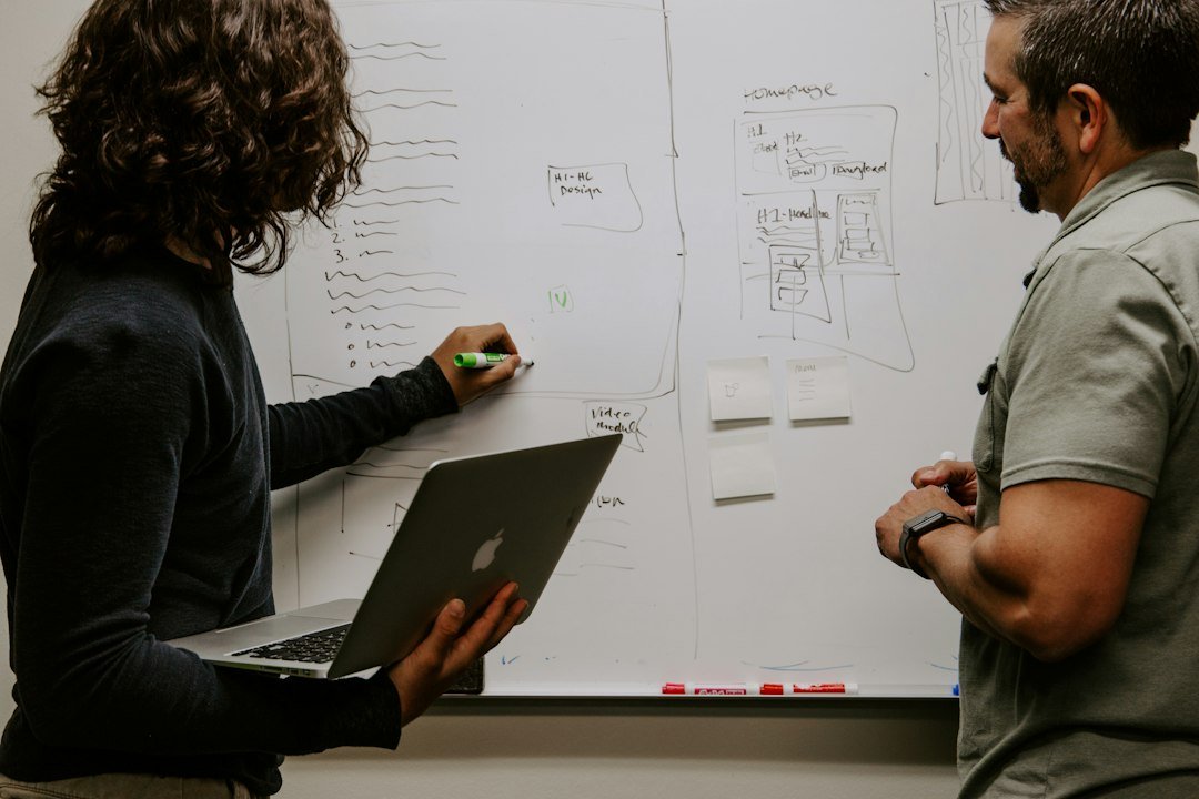 A team discussing project goals at a whiteboard